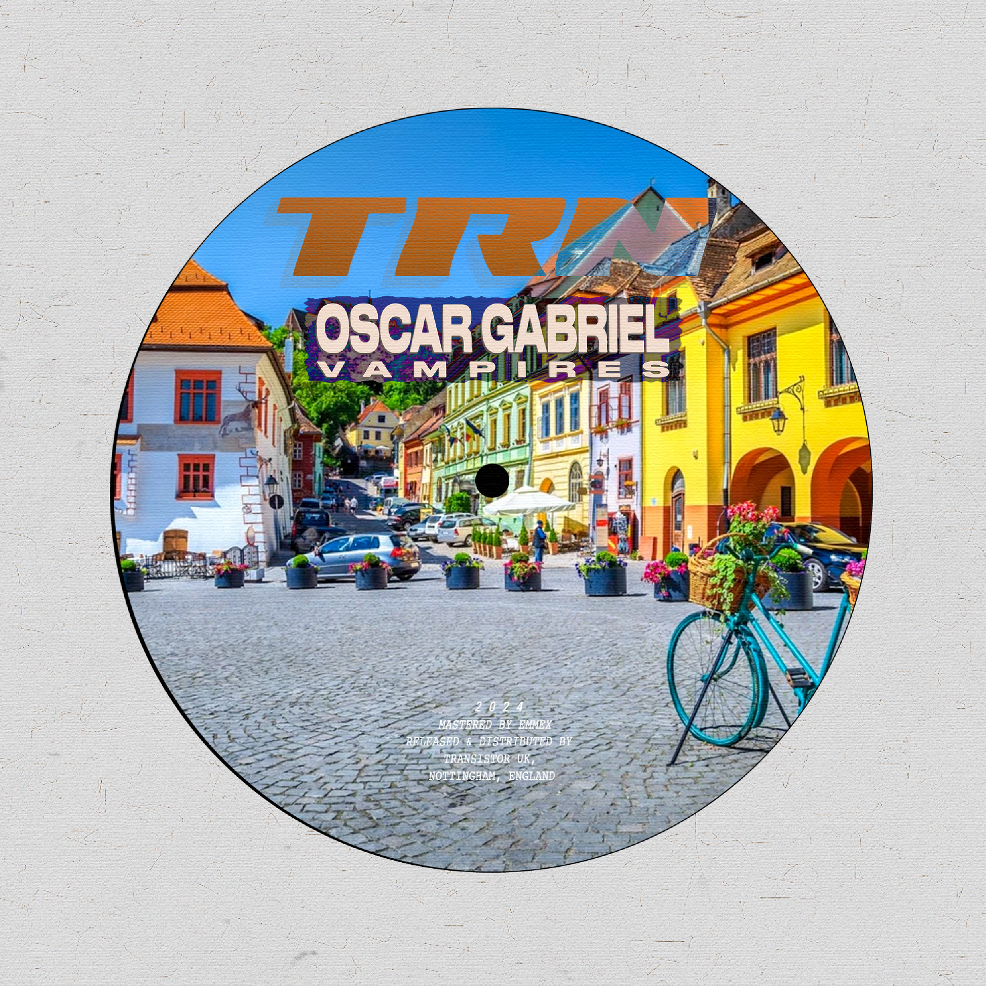 Vinyl record with a colourful cover featuring a street scene and 'TRN' 'OSCAR GABRIEL - VAMPIRES' branding.